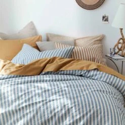 Warm Blue Seersucker Stripe Cotton Pillowcases (Pair) -Piglet Piglet in Bed Seersucker Stripe Bedding Warm Blue 7 5482b059 9ee1 4c1b 9e72 480e1a09e31f